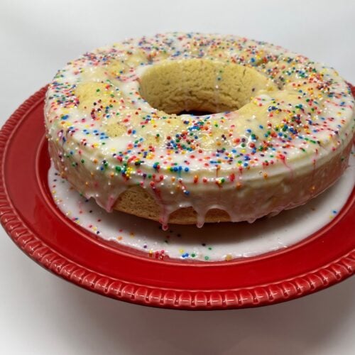 Close up of pigna italian easter cake on a red plaate.