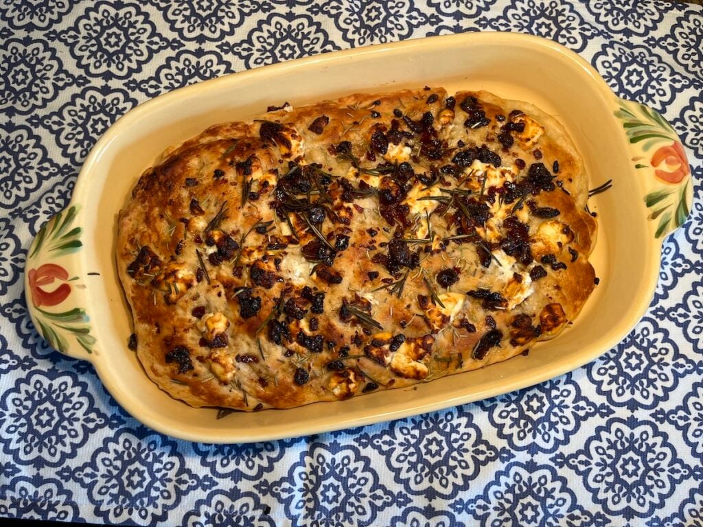 This photo is a finished focaccia with goat cheese.