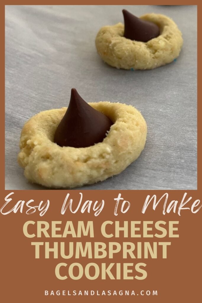Close-up of a delicious cream cheese thumbprint cookie featuring a chocolate drop center on a parchment-lined baking sheet. Text overlay: "Effortless Recipe for Cream Cheese Thumbprint Cookies.