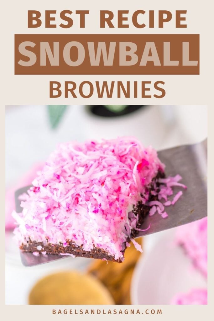 A pink, coconut-topped snowball brownie square rests on a spatula, labeled "Best Recipe Snowball Brownies." Check the website link below for your new favorite treat!.
