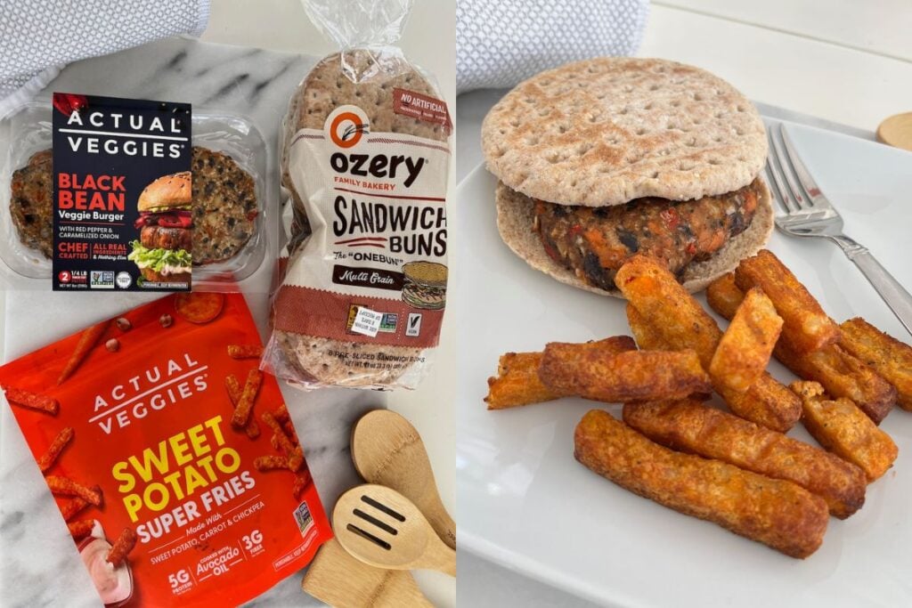 Veggie burger with black bean patty on a sandwich bun, served with sweet potato fries on a white plate. Packaging for the burger and fries visible in the background.
