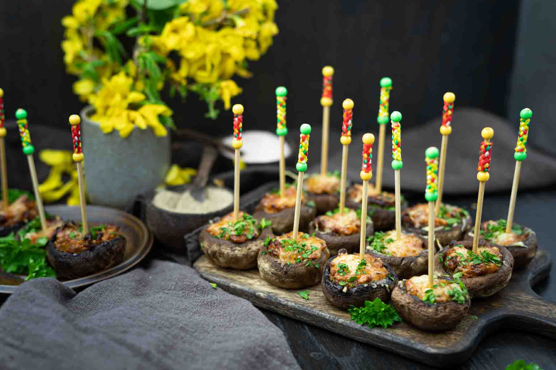 Baked stuffed mushrooms on sticks.
