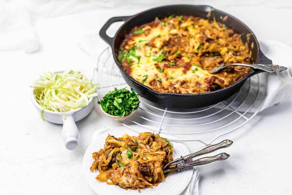 Beef casserole skillet with cabbage sides.