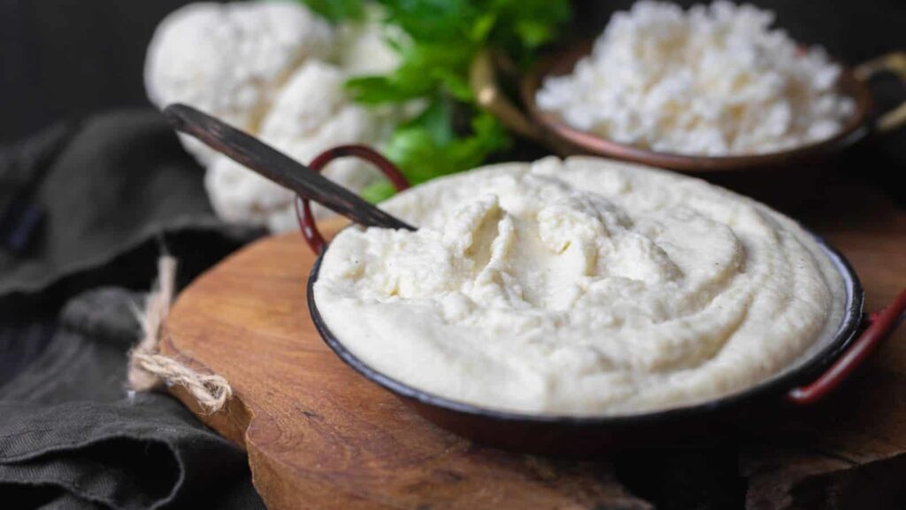 Mashed cauliflower inside a bowl.
