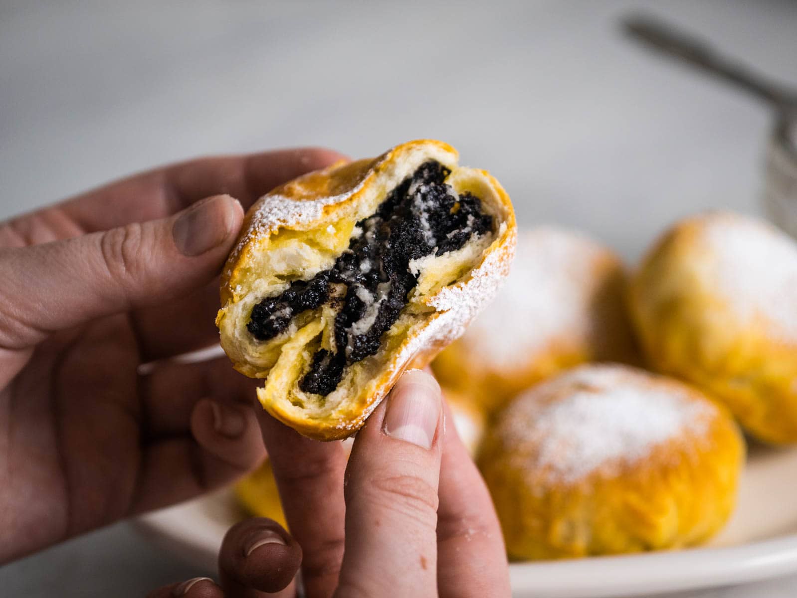 Biscuit stuffed with an oreo broken in half to show insides.