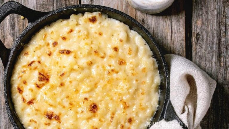 A cast iron skillet filled with baked macaroni and cheese.