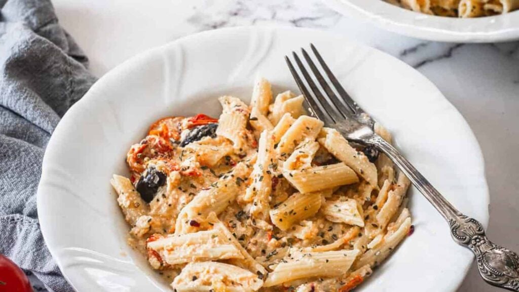 Baked Feta Pasta in white plate.