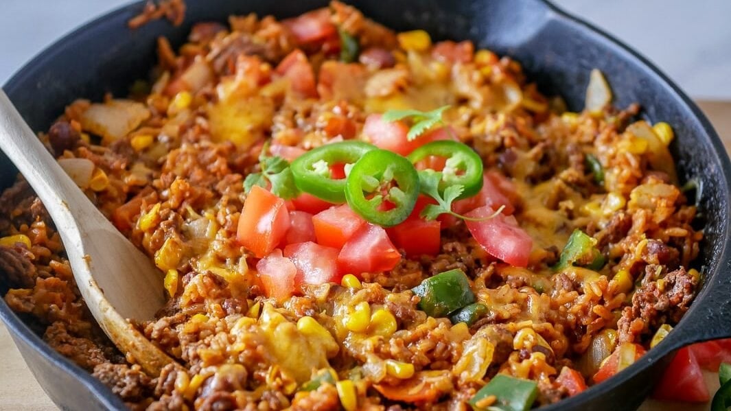Cast iron skillet with easy taco rice dinner.