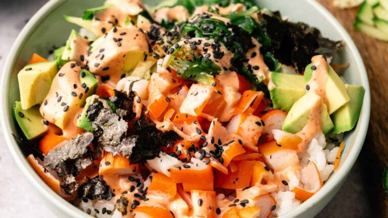 A bowl of food with sauce.