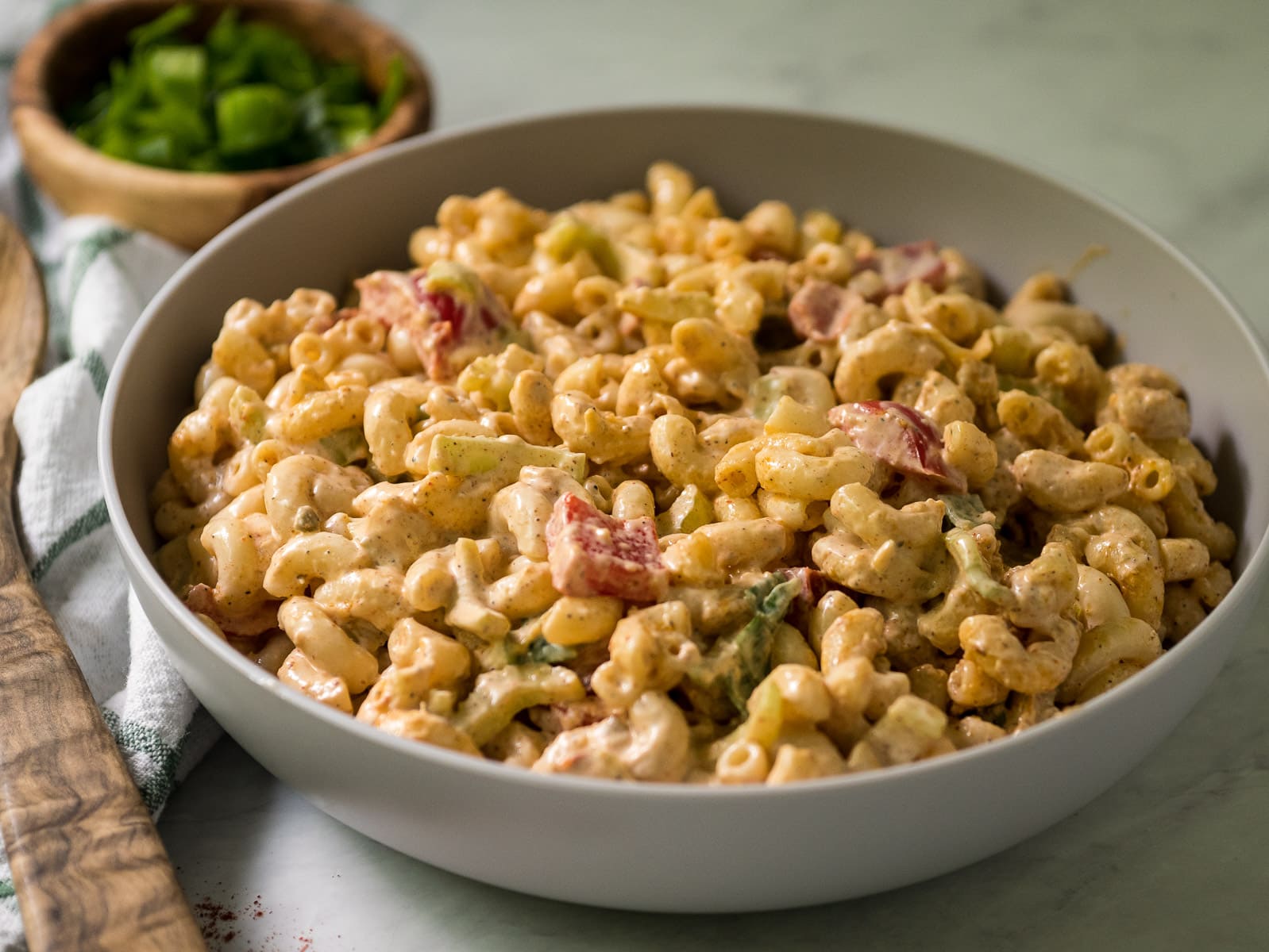 Cajun pasta salad of noodles with celery and bell pepper.