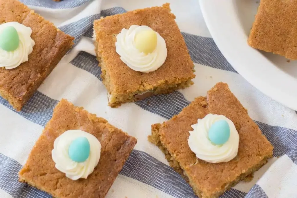 Easter candy cookie bars topped with pastel chocolates and sprinkles.