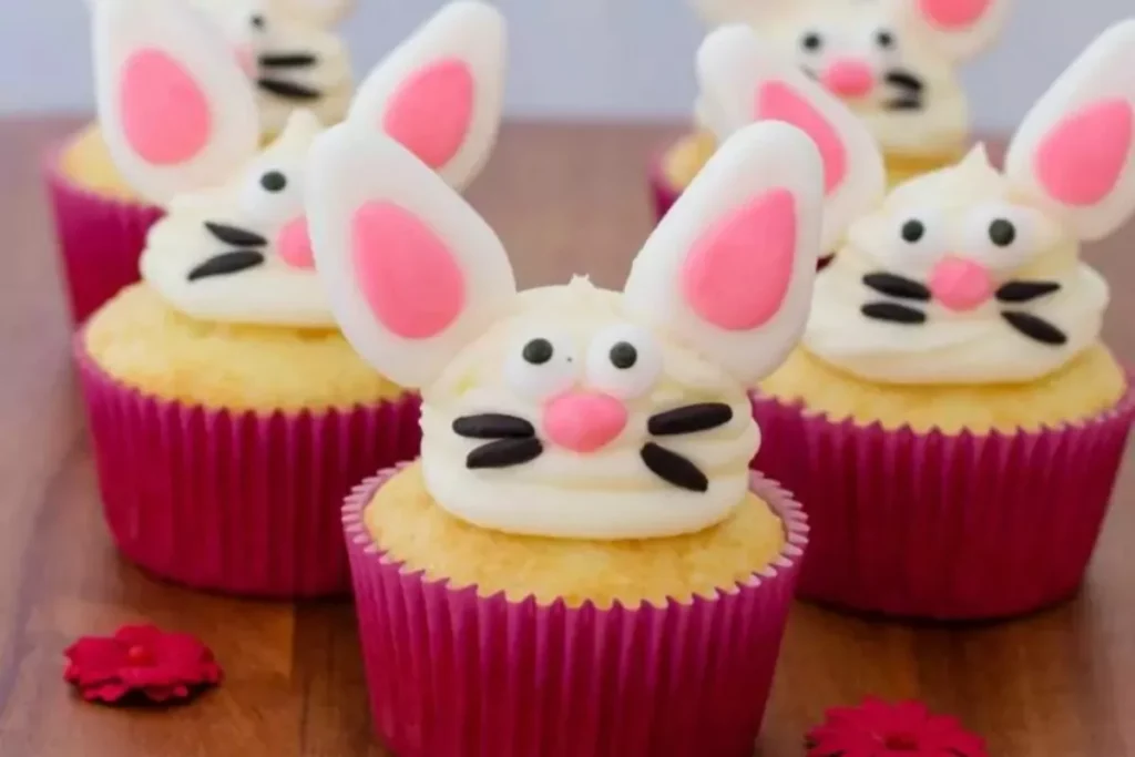 Easter bunny cupcakes decorated with pink ears and coconut “fur.”
