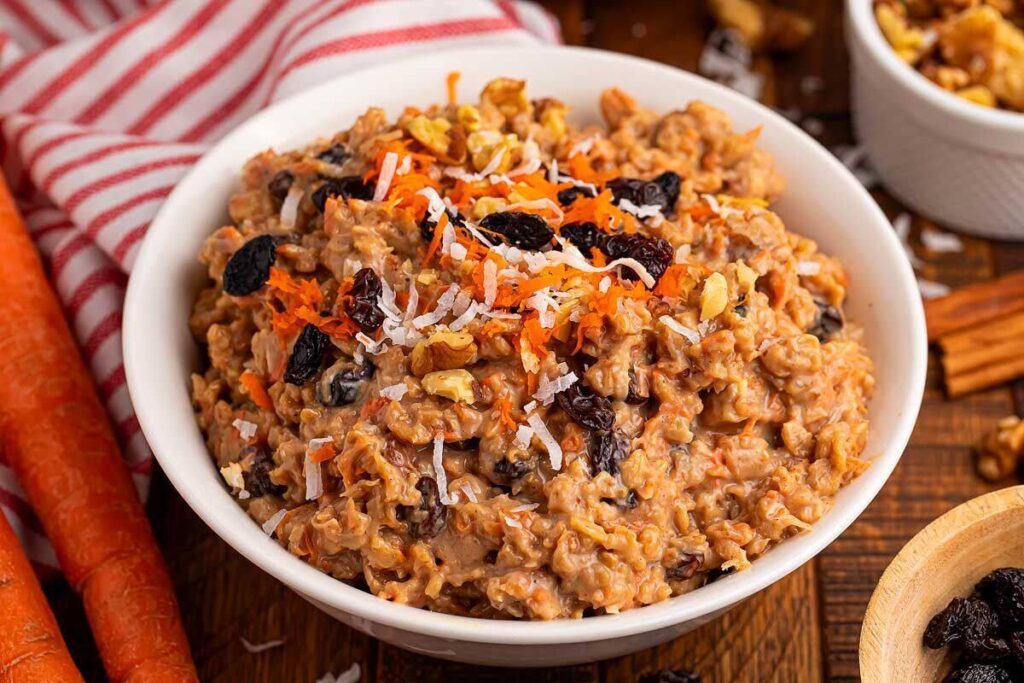  A bowl of slow cooker carrot cake oatmeal with raisins.