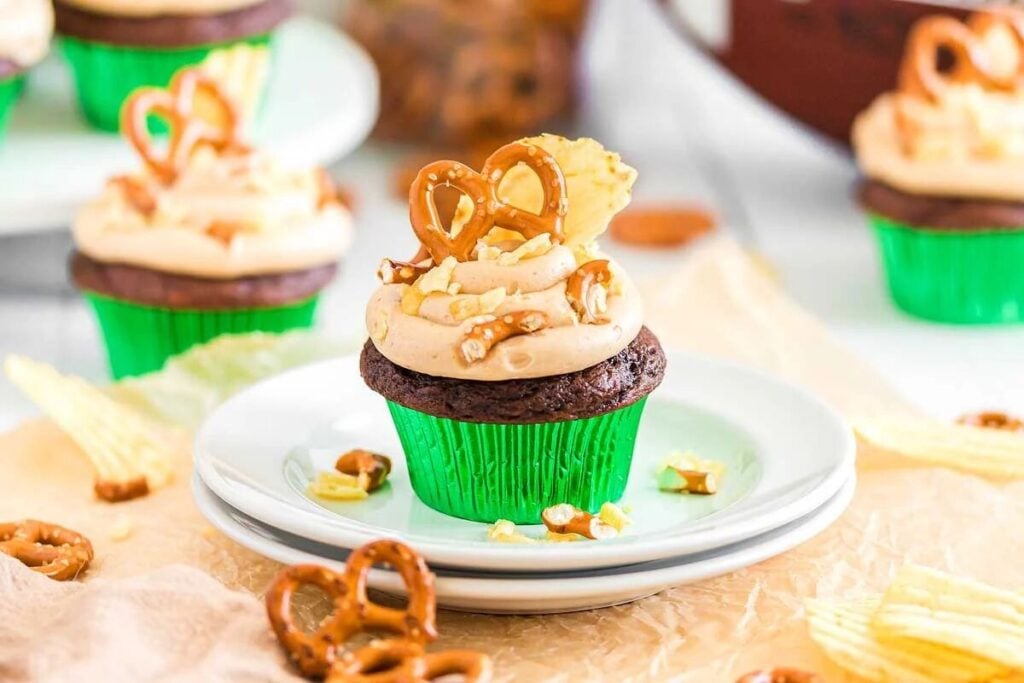 Chocolate kitchen sink cupcakes with pretzels on a plate.
