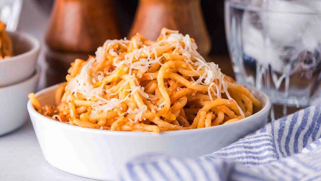 A serving of Baked Cream Cheese Spaghetti in a white bowl.